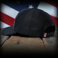 Load image into Gallery viewer, Blacked Out Debossed American Flag Trucker Hat