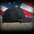 Load image into Gallery viewer, Blacked Out Debossed American Flag Trucker Hat
