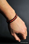 Load image into Gallery viewer, Thin Red Line Two Sided Silicone Wristbands Skull Logo Reverse Side
